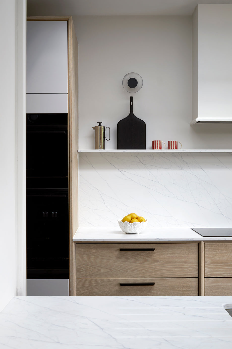 Bespoke Kitchen, Bespoke kitchen design, Bespoke Kitchen south east London, Kitchen design, Minimal kitchen, Minimal kitchen design, Kitchen Island, Kitchen specialist, Shaker kitchen, Shaker style cabinets, Larder, Utility Room, Modern Shaker kitchen, Wine-rack, kitchen ideas, coffee station, kitchen shelving, pendant lights, kitchen stools, french lighting, sleek kitchens, trending kitchens, kitchen trends, minimal living, minimal living kitchens, oak veneer kitchen, mono coat staining 