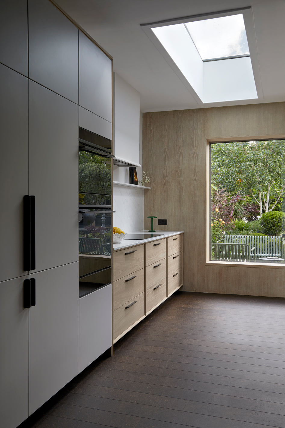 Bespoke Kitchen, Bespoke kitchen design, Bespoke Kitchen south east London, Kitchen design, Minimal kitchen, Minimal kitchen design, Kitchen Island, Kitchen specialist, Shaker kitchen, Shaker style cabinets, Larder, Utility Room, Modern Shaker kitchen, Wine-rack, kitchen ideas, coffee station, kitchen shelving, pendant lights, kitchen stools, french lighting, oak kitchen, feature window, kitchen feature window, marble surfaces, kitchen marble services, black handles, metal kitchen handles, sky light, kitche