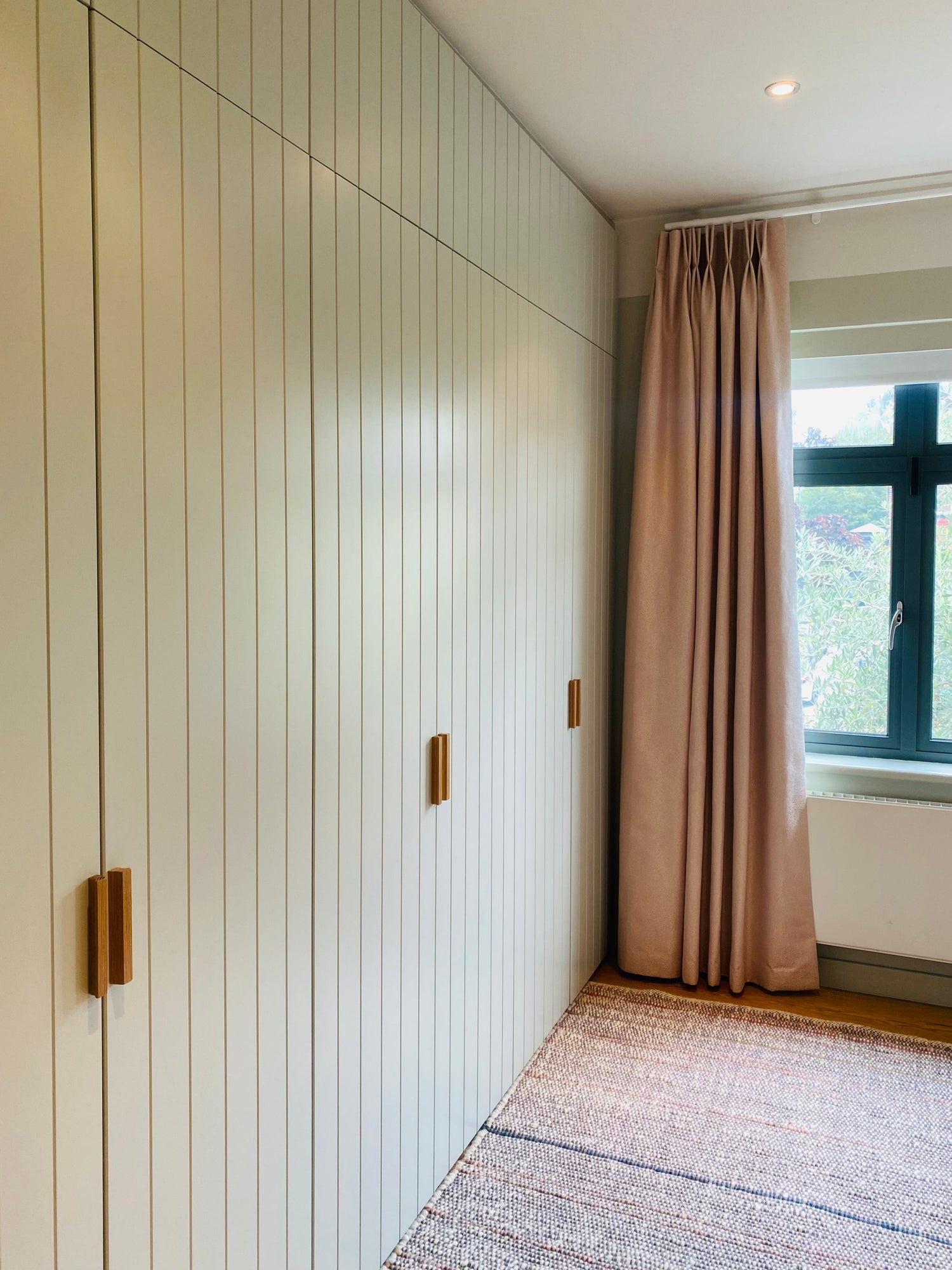 Fitted wardrobes, wardrobes, south east London, bespoke, walk in closet, bedroom storage solutions, made to measure wardrobe, shaker doors, custom made, best joinery London, bespoke wardrobe design, modern joinery, luxury joinery, high end joinery, joinery services, Interior design, bedside table, modern bedroom, bedroom joinery, storage solutions, tongue and grove wardrobe, pistachio colour, wooden handles, tongue and groove, cottage style wardrobes.